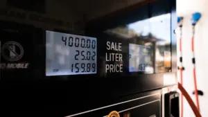 Close up of a fuel pump digital display showing price and volume statistics.